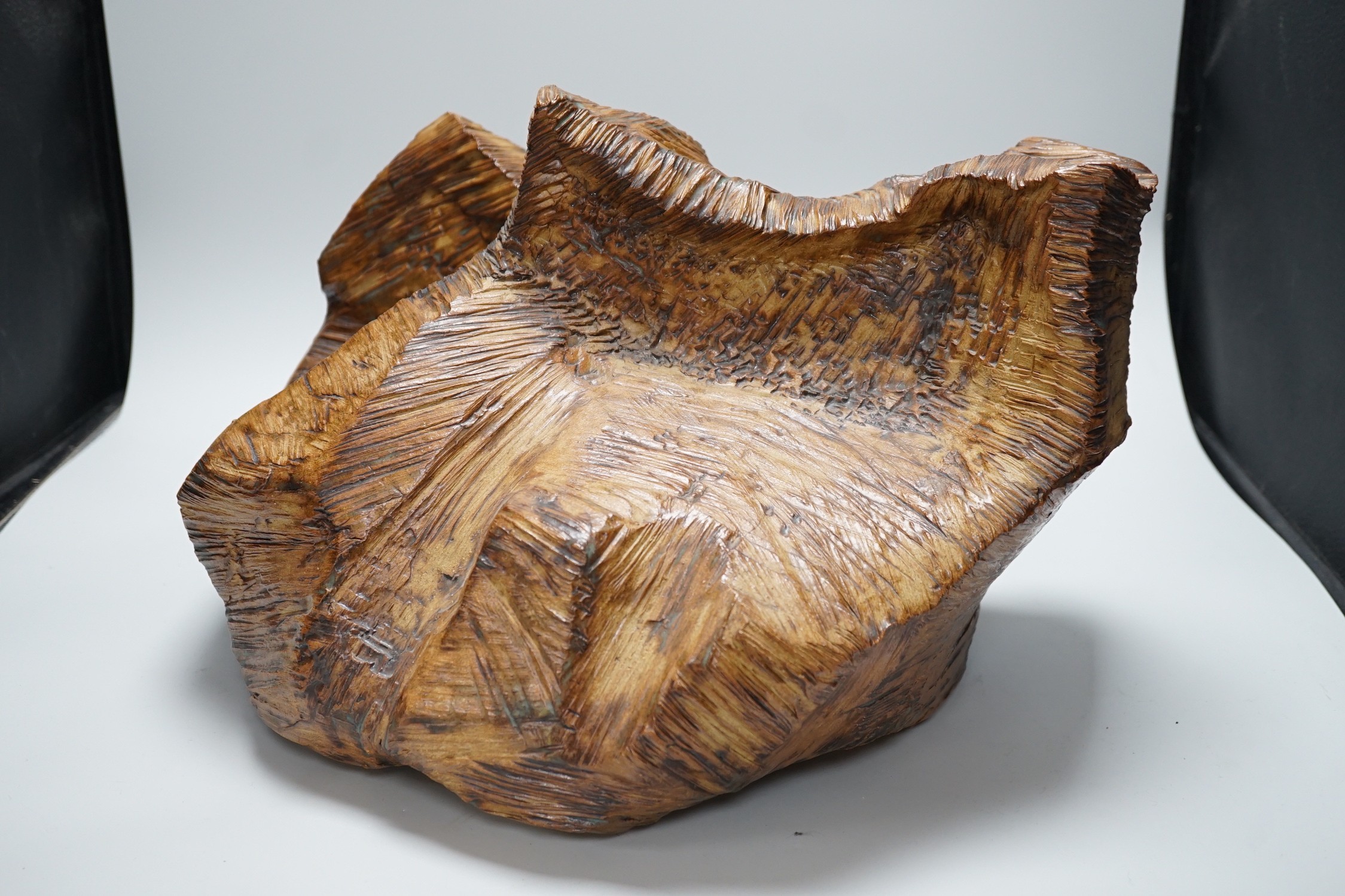 Ruth Sulke - a studio pottery copper-glaze abstract sculpture of a simulated hewn and chisled log, 43cms wide x 28.5 high